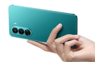 Realme P4x in Lake Green showing dual camera module being held in hand